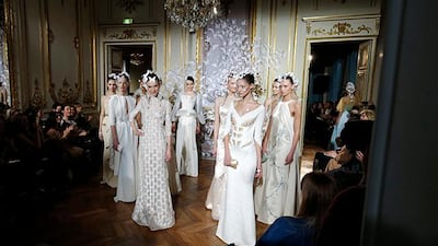 Models present creations by French designer Alexis Mabille as part of his Haute Couture Spring/Summer 2014 fashion collection in Paris January 20, 2014. REUTERS/Gonzalo Fuentes (FRANCE - Tags: FASHION)