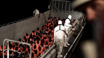 Migrants are rescued by staff members of the MV Aquarius, a search and rescue ship run in partnership between SOS Mediterranee and Doctors Without Bordersin the central Mediterranean Sea, June 10, 2018. Karpov/handout via REUTERS