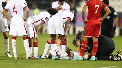A medic attends to Al Rawi after he sustained an injury.