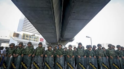 Thai soldiers block access to a section of an overpass during a protest against the military coup in Bangkok on Saturday. Diego Azubel / AFP