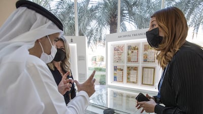 Guests ask questions at the exhibition. Ruel Pableo / The National