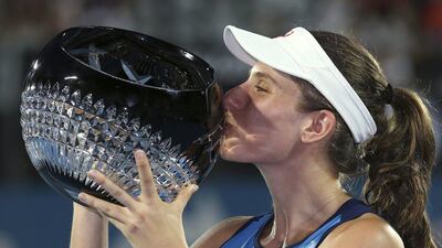 Britain's Johanna Konta kisses her trophy after defeating Agnieszka Radwanska of Poland in the women's singles final match at the Sydney International tennis tournament in Sydney Friday, Jan. 13, 2017. AP Photo