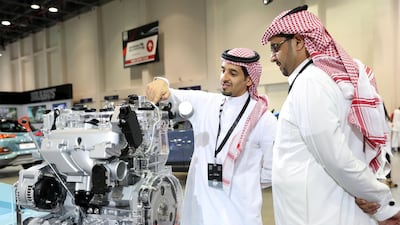 Visitors look at a Hyundai high-performance engine. Chris Whiteoak / The National
