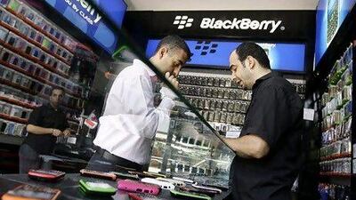 A Lebanese man looks at BlackBerry phones at a BB shop in downtown Beirut on Augut 6, 2010. Lebanon will assess security concerns relating to the use of BlackBerry in the country following the arrest of several telecom employees suspected of spying for Israel, the chairman of the Telecoms Regulatory Authority said. AFP PHOTO/JOSEPH EID *** Local Caption *** 144754-01-08.jpg