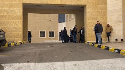 Families of the victims wait outside the morgue to collect the bodies of their loved ones.