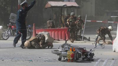 Afghan security forces are seen at the site of a second blast in Kabul that killed 25 people. Omar Sobhani / Reuters