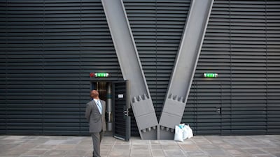 A security guard looks up from a roof terrace on an upper floor of the newly constructed Leadenhall Building. Oli Scarff / Getty Images