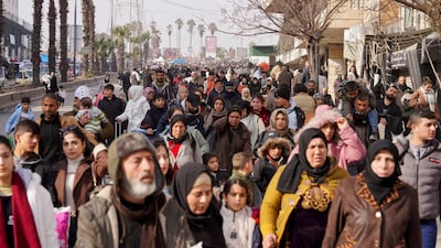 Crowds make their way through Aleppo. Reuters