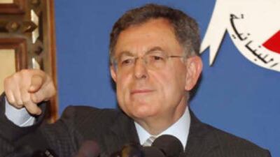 Mr Siniora forms a national unity Cabinet in which Hizbollah and its opposition allies have veto power over government decisions