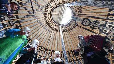 Performers in traditional ethnic costume lead the celebrations in Bishkek. AFP