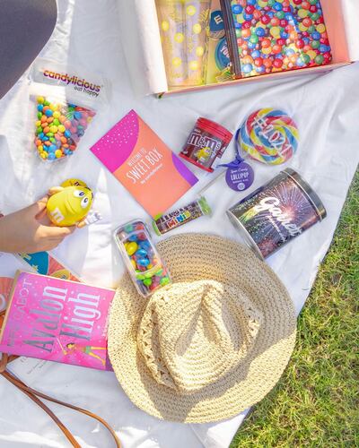 The Candylicious box has all types of M&M's plus a giant 2021 lollypop