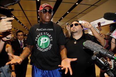 Former NBA basketball player Dennis Rodman arrives at Singapore's Changi Airport on Tuesday, June 12, 2018. AP Photo/Wong Maye-E