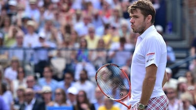 Switzerland's Stanislas Wawrinka reacts after losing to South Africa's Kevin Anderson in a second round match at the ATP Aegon Championships tennis tournament at the Queen's Club in west London on June 17, 2015. AFP PHOTO / LEON NEAL