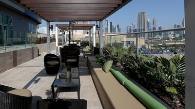 The pool and garden area of the penthouse apartment overlooking Burj Khalifa and The Dubai Mall. Satish Kumar / The National