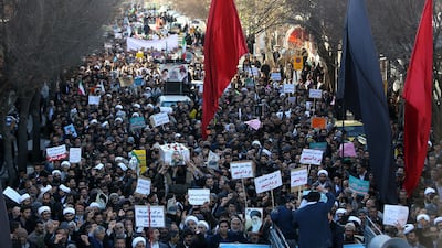 Iranian pro-government supporters march during the funeral of a young member of the Revolutionary Guards, Sajjad Shahsanai, in the city of Najafabad. Morteza Salehi / AFP