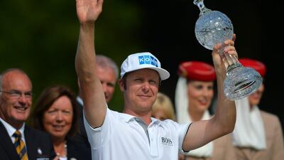 Finland's Mikko Ilonen celebrates with the trophy for his victory at the Irish Open on Sunday. Mark Runnacles / Getty Images / June 22, 2014