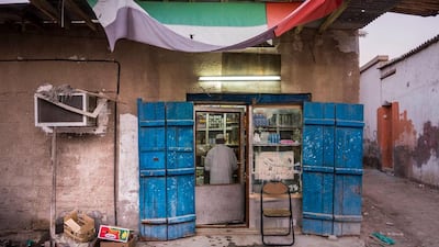 Mohammed Khasan stands in the doorway of the shop he has been running for more than 40 years in the old neighbourhood.
