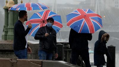 British union flag umbrellas on Westminster Bridge in central London. AP Photo