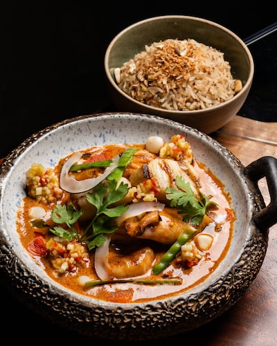 Encocado with black cod, prawns, squid, coconut, aji mirasol and rice. Photo: Marriott International