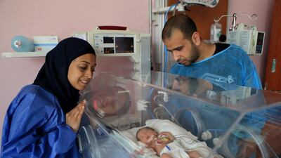 Mohammed Othman and Eman Ahmed watch over their little girl Tala at Sheikh Khalifa General Hospital in Ajman. Tala was born 11 weeks premature, but the couple are hoping to take her home this month. Ravindranath K / The National
