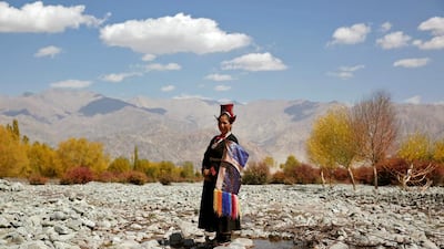 Tsewang Dolma, 33, a farmer and housewife poses for a photograph in Matho, a village nestled high in the Indian Himalayas. When asked how living in the world's fastest growing major economy had affected life, Dolma replied: "Our culture is spoiled now. We don't wear our traditional dress."