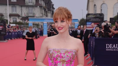 Jessica Chastain, in a pink floral strapless Oscar de la Renta dress, arrives at the opening ceremony of 40th Deauville American Film Festival on September 5, 2014 in France. Getty Images