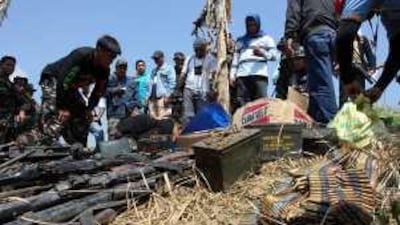 Soldiers are seen at a site in Maguindanao, where weapons and ammunition were found yesterday.