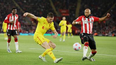Liverpool's James Milner in action against Southampton's Nathan Redmond. Reuters