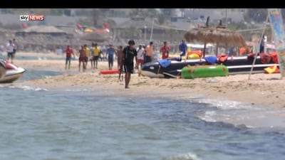 Gunman Seifeddine Rezgui is seen in front of a line of hotel workers on the beach in Sousse, Tunisia. Photo: Sky News