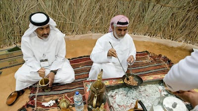 Saif Obaid Al Khabi and Moahmmed Al Khabi make traditional Arabic coffee. Antonie Robertson / The National