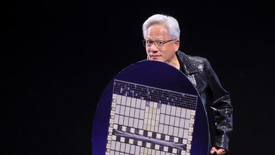 Nvidia chief executive Jensen Huang holds a shield designed to look like a computer chip, as he gave an address at CES 2025 in Las Vegas early in January. Reuters