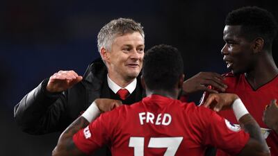 Solskjaer celebrates the result with his players. Getty
