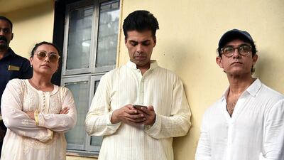 Actress Rani Mukharjee, director Karan Johar and actor Aamir Khan attend the funeral of Krishna Raj Kapoor. AFP