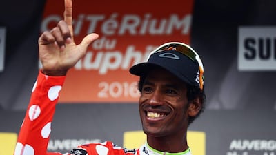 Daniel Teklehaimanot of Eritrea and Team Dimension Data smiles after winning the King of the Mountains jersey at the 2016 Criterium du Dauphine on Sunday. Bryn Lennon / Getty Images / June 12, 2016