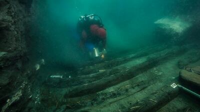 A diver examines the remains of an ancient military vessel discovered in the Mediterranean sunken city of Thonis-Heracleion off the coast of Alexandria, Egypt. Reuters