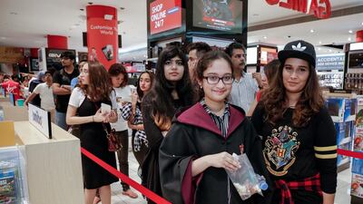 Hibah and Sarah Ali patiently waiting in line during the Harry Potter and the Cursed Child book launch at Virgin Megastore at Mall of the Emirates. Victor Besa for The National