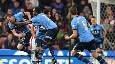 Harry Kane, left, celebrates after scoring Tottenham’s first goal. Paul Ellis / AFP