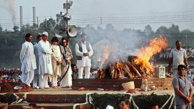 Rajiv Gandhi, front row, left, accompanied by his wife Sonia, third from left, and daughter Priyanka, second from left, at the cremation of his mother, Indira, on November 3, 1984, three days after her assassination. Gabriel Duval / AFP