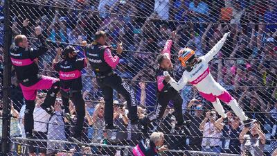 Helio Castroneves of Brazil celebrates winning the Indianapolis 500 auto race. AP Photo