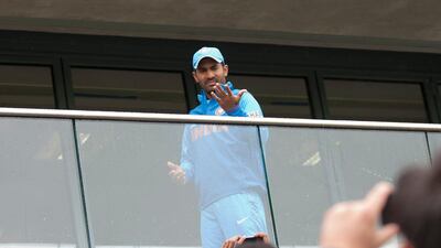Dinesh Karthik, Kohli's fellow batsman in the India middle-order, was visibly restless. But he did get a little attention from fans. Jon Super / AP Photo