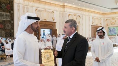 Sheikh Mohammed bin Zayed, Crown Prince of Abu Dhabi and Deputy Supreme Commander of the UAE Armed Forces (L), receives Mohamed Abdul Money Abdul Hafiz, Secretary General of the National Council for Care of Martyrs Families and the Injured in Egypt (2nd L), during a Sea Palace barza. They are seen with Sheikh Khalifa bin Tahnoon bin Mohamed Al Nahyan, Director of the Martyrs' Families' Affairs Office of the Abu Dhabi Crown Prince Court (R). Rashed Al Mansoori / Crown Prince Court - Abu Dhabi