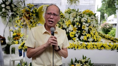 Former Filipino president Benigno Aquino speaks next to the tomb of his mother, former president Corazon Aquino, and father, former senator Benigno 'Ninoy' Aquino, during a mass in Paranaque City on August 1, 2019. EPA