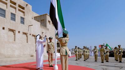 Sheikh Maktoum bin Mohammed, First Deputy Ruler of Dubai and Deputy Prime Minister, hoists the UAE flag. Photo: @DXBMediaOffice X / formerly Twitter