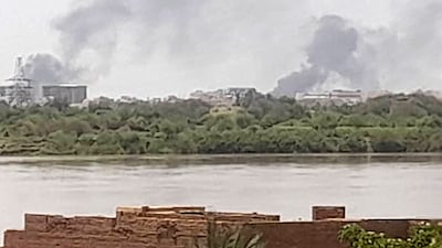 Smoke billows in the distance north of the Khartoum Bahri district amid ongoing fighting on July 14, 2023. AFP