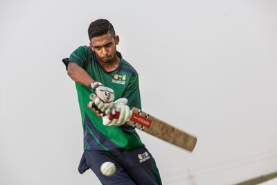 Young cricketer Jonathan Figy practices at the Zayed Cricket Stadium. Antonie Robertson / The National