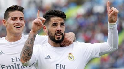 Real Madrid’s midfielder Isco (R) jubilates with his teammate, Colombian midfielder James Rodriguez (L) his goal against Getafe FC during their La Liga match played at Coliseum Alfonso Perez stadium in Getafe, Madrid, Spain on 15 April 2016. EPA/Ballesteros
