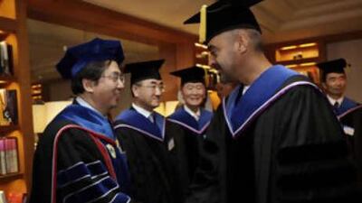Sheikh Mohammed bin Zayed, Crown Prince of Abu Dhabi and Deputy Supreme Commander of the UAE Armed Forces, right, greets KAIST faculty after receiving an honorary diploma.