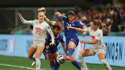 Alicia Barker of Philippines competes for the ball against Alisha Lehmann and Noelle Maritz of Switzerland. Getty Images