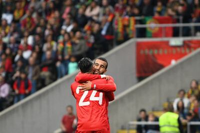 Anice Badri (No 24) celebrates with Tunisia teammate Naim Sliti after scoring a goal during the international friendly football match against Portugal in Braga on May 28. Octavio Passos / Getty Images