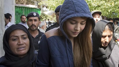 Pakistani model Ayyan Ali was detained in March for trying to fly to Dubai with half a million dollars in her bags. B K Bangash / AP Photo